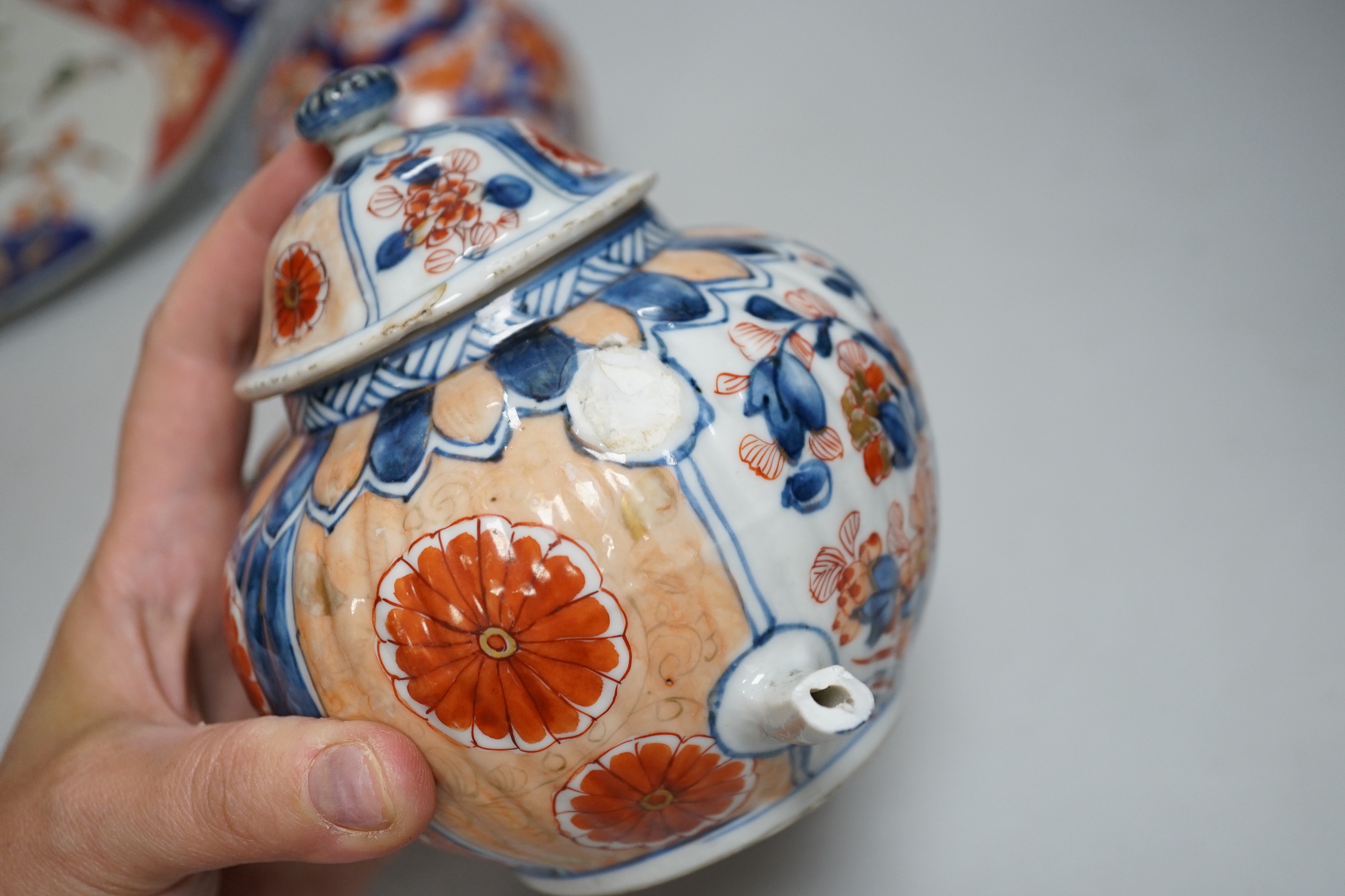 Nine Japanese Imari pieces including; a charger, lidded pot, a bowl, four small gourd vases, two lidded vases and a teapot (a.f.), charger 31cm diameter